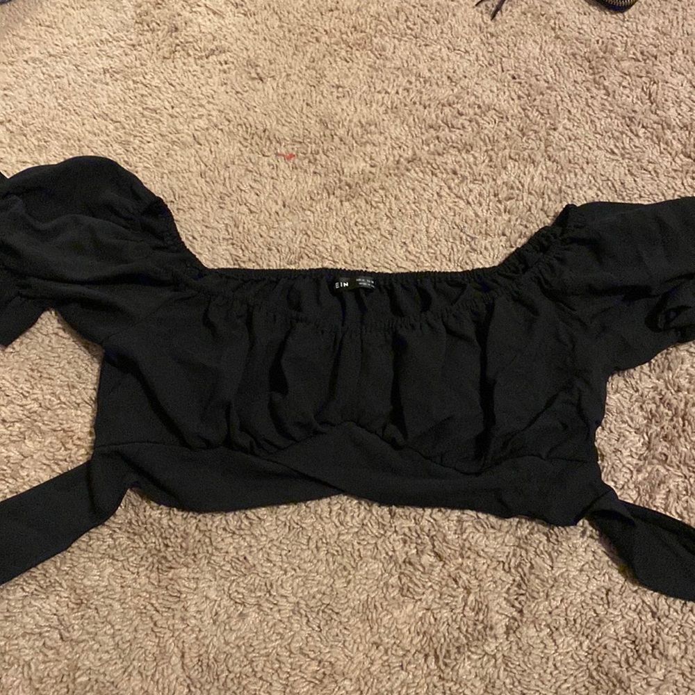 Black off the shoulder crop top.
